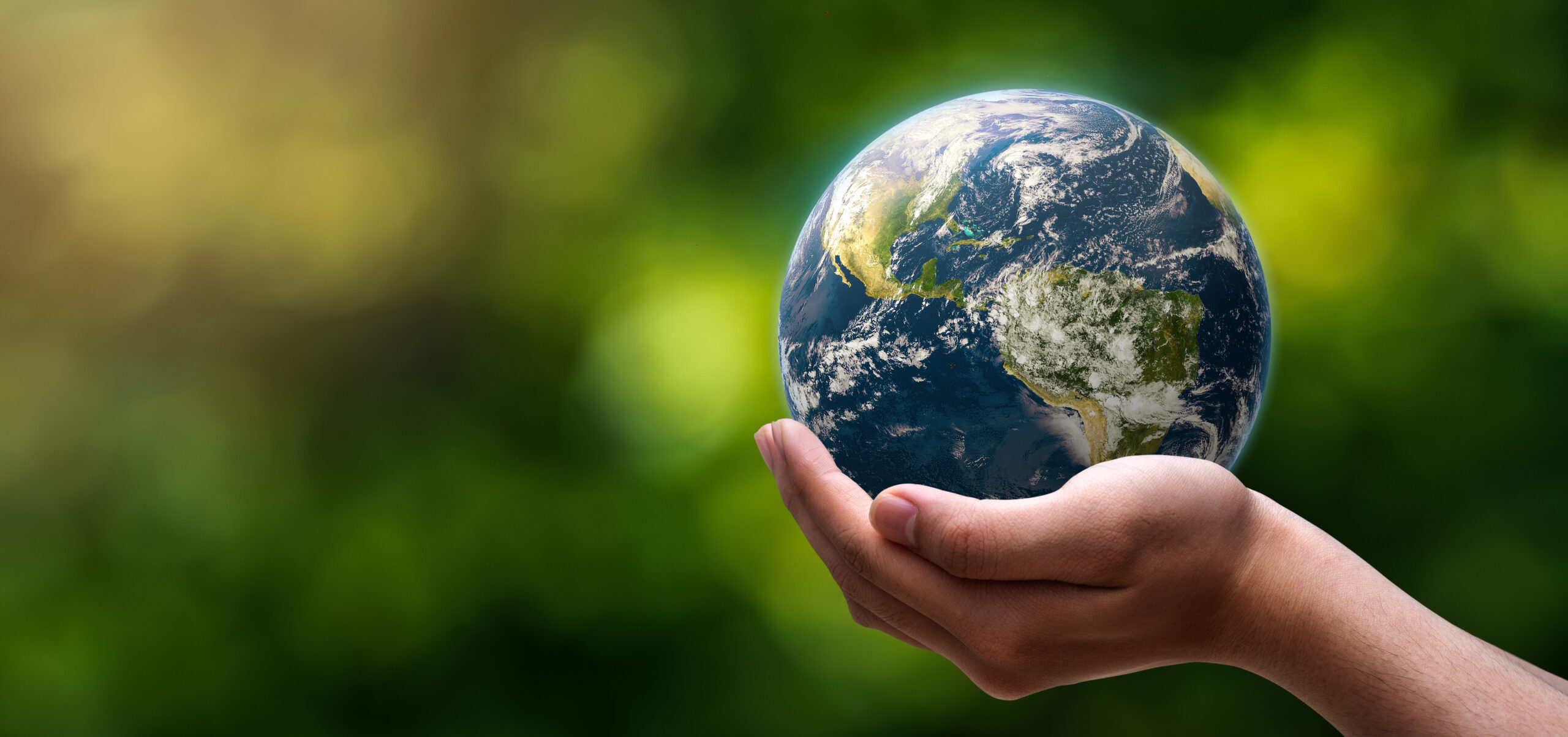 globe blue on hands in green blurred nature background, earth in adult hands , earth day, world day, energy saving concept, Elements of this image furnished by NASA.